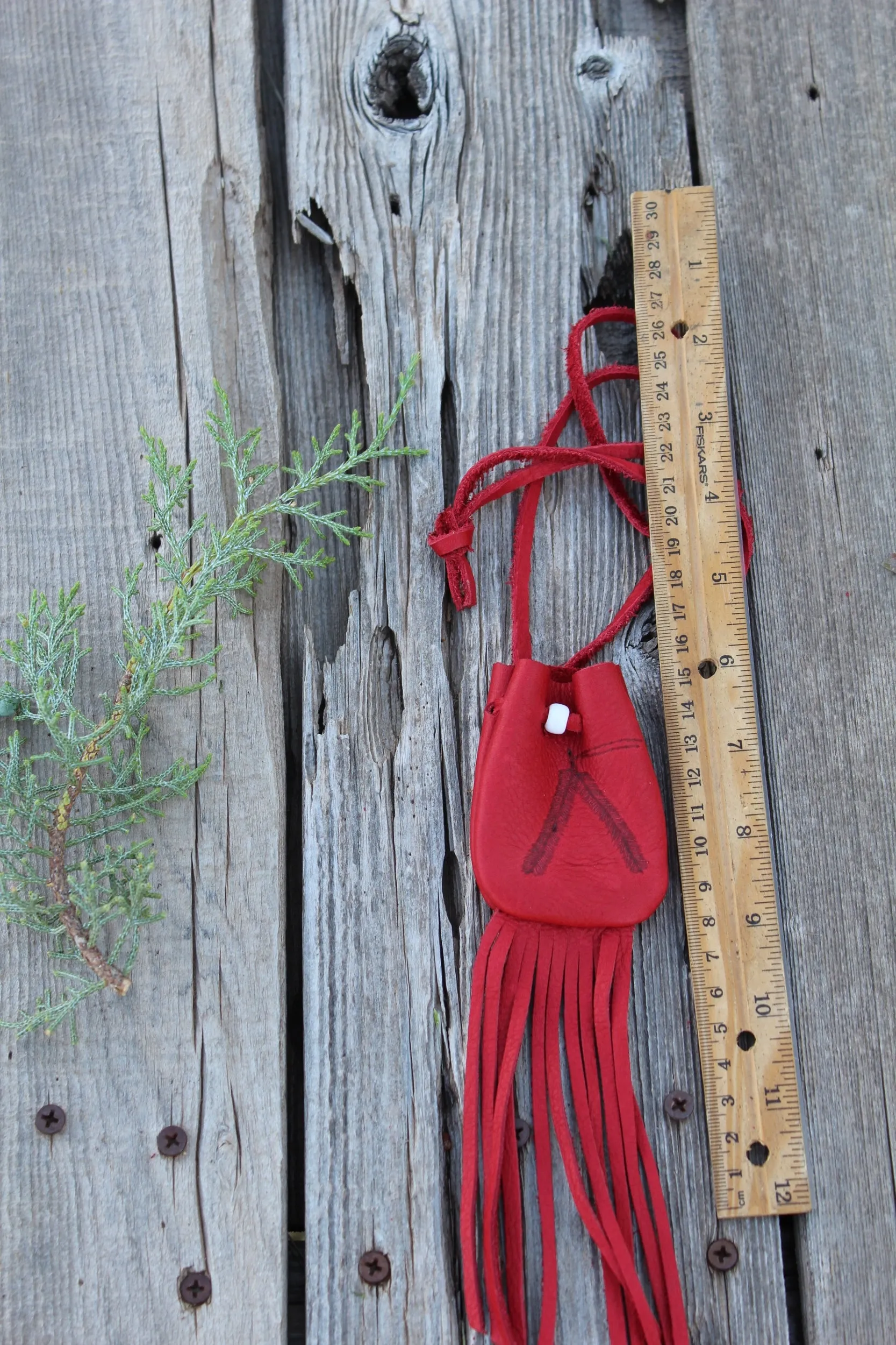 Fringed red leather medicine bag, red leather bag